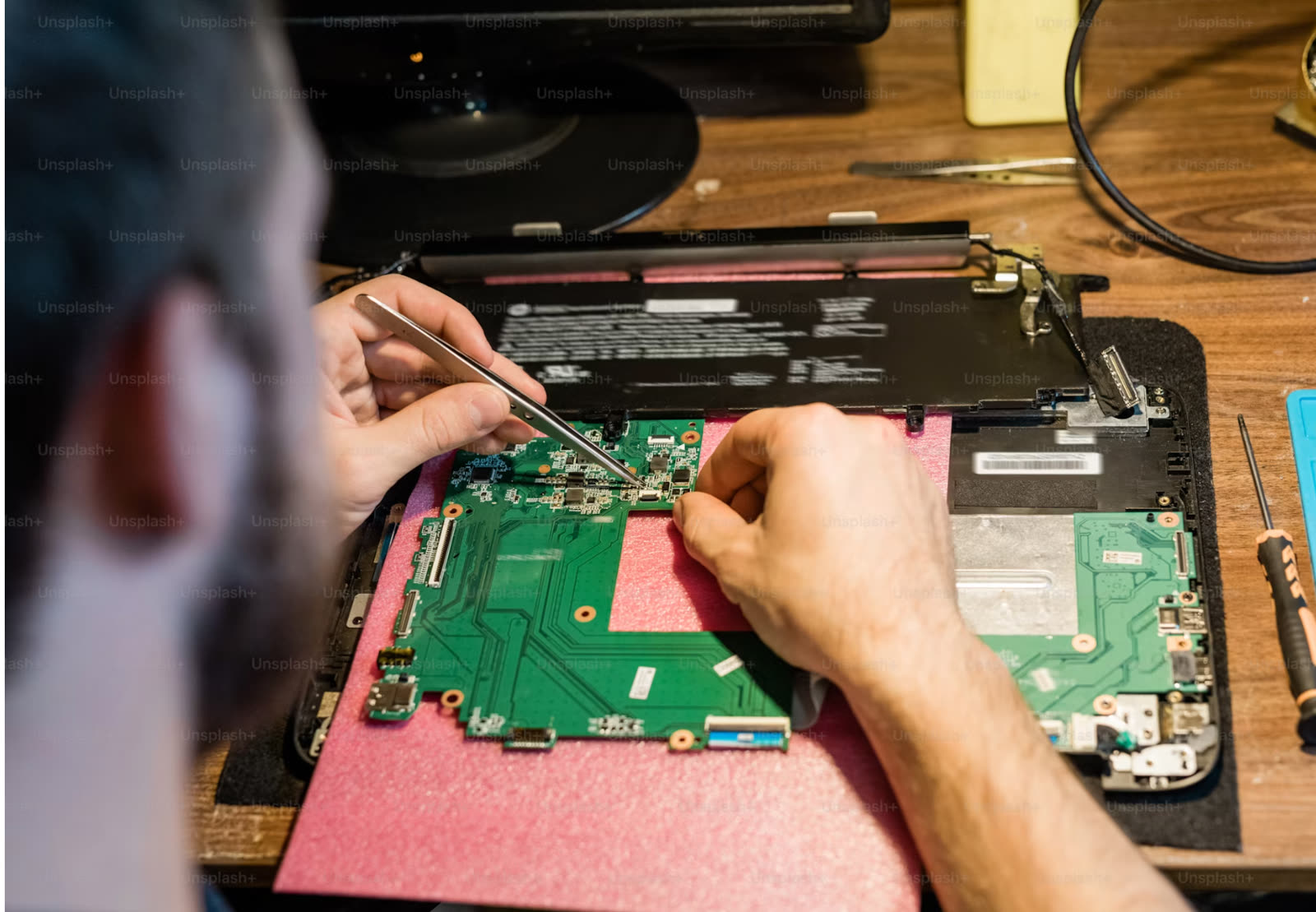 Repair workbench with PC and tools